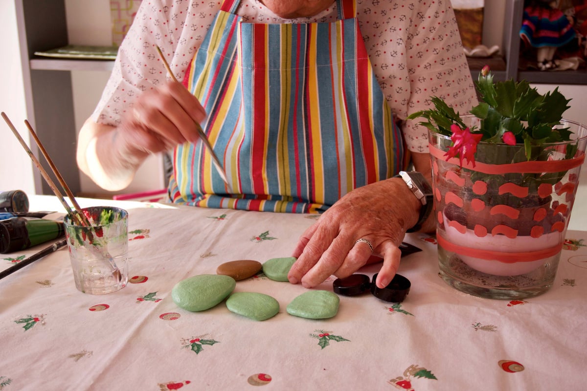 Woman making arts crafts using stone